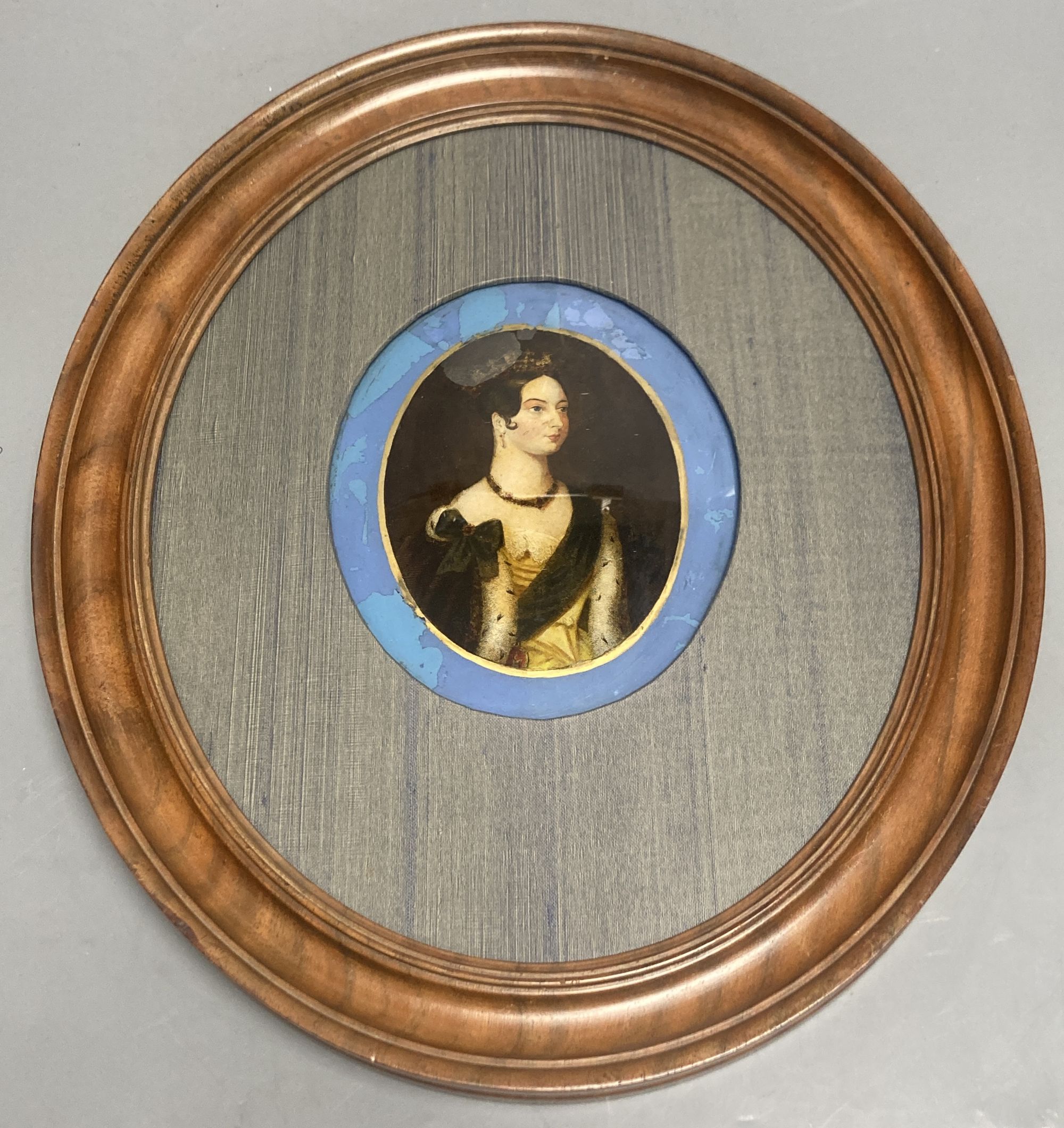 An oval reverse print on glass of Queen Caroline?, frame 33.5cm high